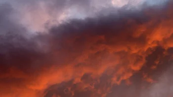 Flaming sunset clouds in the evening sky