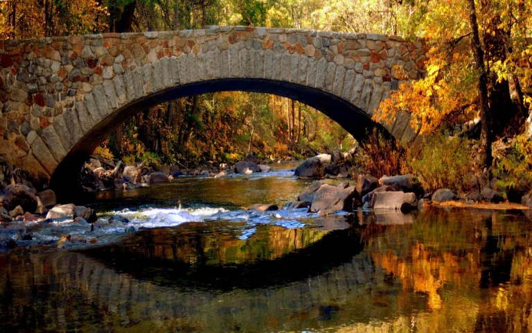 an ancient stone bridge over a mountain river, autumn, autumns, bridges, forest, forests, leaves, foliage, leafage, frondage, reflections, rivers, canals, streams, trees, nature
