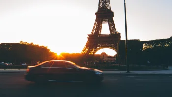 the eiffel tower bathed in the rays of the setting sun over paris, the eiffel tower, cities, city, cityscape, cityscapes, eiffel tower, france, paris, roads, highways, motorways, avenues, driveways, passageways, streets, architecture, world