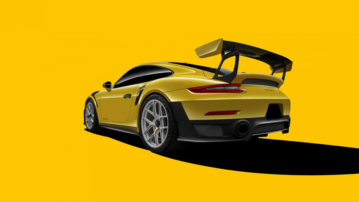 A bright yellow Porsche 911 GT2 RS against a solid-color background