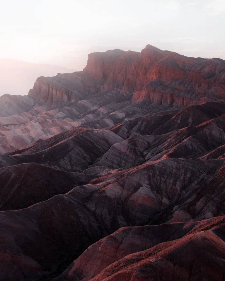 The setting sun's rays on the slopes of Zabriskie Point in Death Valley