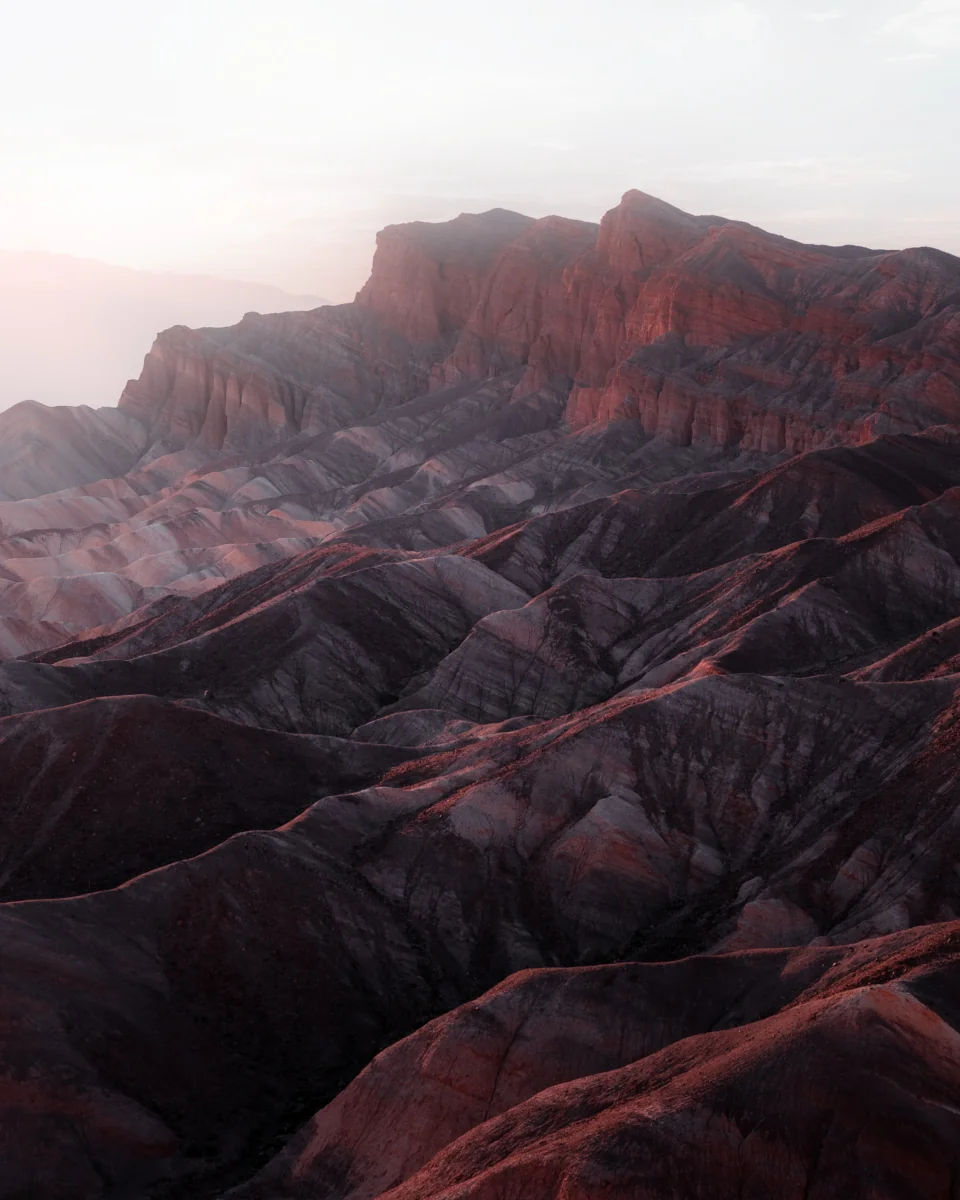 The setting sun's rays on the slopes of Zabriskie Point in Death Valley