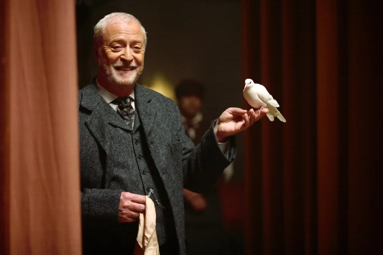 michael caine as a magician with a white dove on his hand, michael caine, birds, characters, actors, cinema, pigeons, prestige, movies