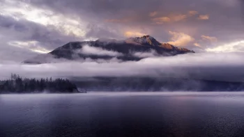 cecil peak, shrouded in clouds, above lake wakatipu in new zealand, cecil peak and lake wakatipu, new zealand, clouds, fog, lakes, bodies of water, landscapes, mountains, peaks, hills, trees, nature, world