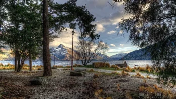 the tranquil shore of lake wakatipu in new zealand, lake wakatipu, new zealand, herb, herbs, lawns, lakes, bodies of water, landscapes, mountains, peaks, hills, stones, trees, nature, world