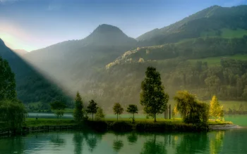 Morning sunlight over a lake in the Swiss Alps