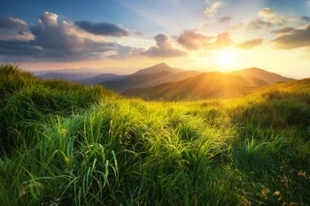 Golden rays of sunlight over the mountain peaks