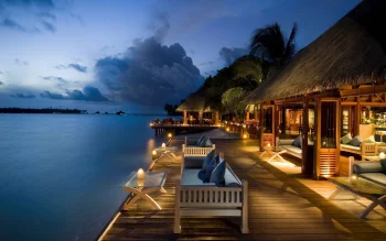 an evening of relaxation on the terrace of a maldivian resort by the ocean, clouds, evening, evenings, twilight, dus, landscapes, little houses, huts, cottages, maldives, ocean, oceans, pacific ocean, palm trees, terraces, nature, world