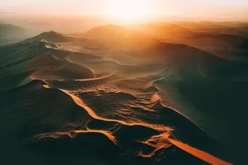 The golden dunes of the Namib in the rays of the setting sun