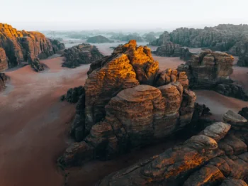 The golden rays of the setting sun on the rocks of the Wadi Rum desert