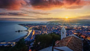 Sunset over the Blanes coast, with a view of the historic church
