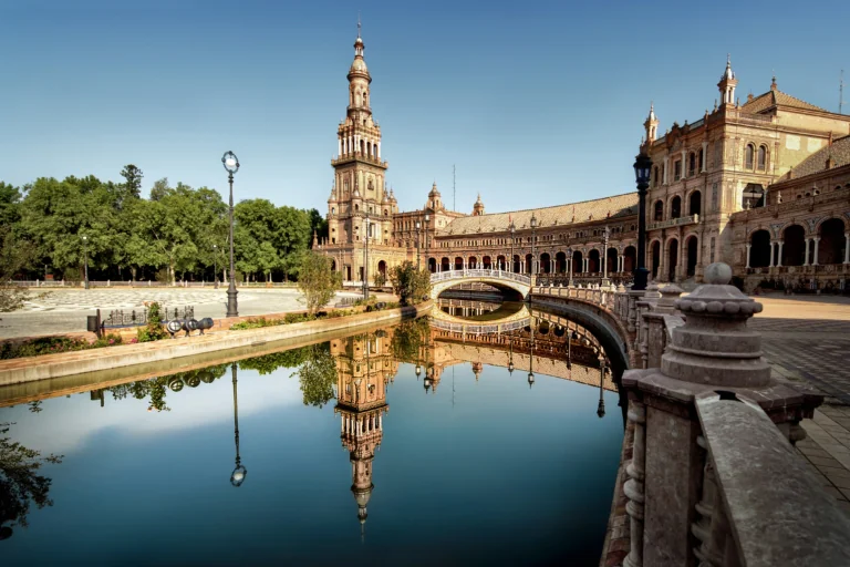 Plaza de España in Seville, reflected in the canal