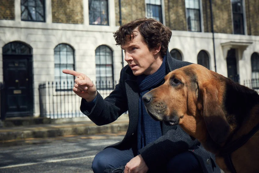 Sherlock Holmes with a bloodhound on a London street