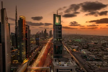 The sunset lights of the Burj Khalifa skyscrapers and Sheikh Zayed Road in Dubai