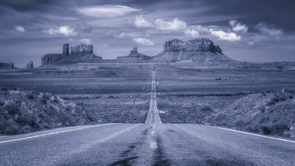 The endless road to the cliffs of the Valley of Monuments at dusk