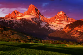 Sunset rays on the peaks of the Grand Teton Mountains in Wyoming