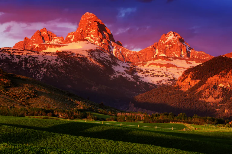 Sunset rays on the peaks of the Grand Teton Mountains in Wyoming
