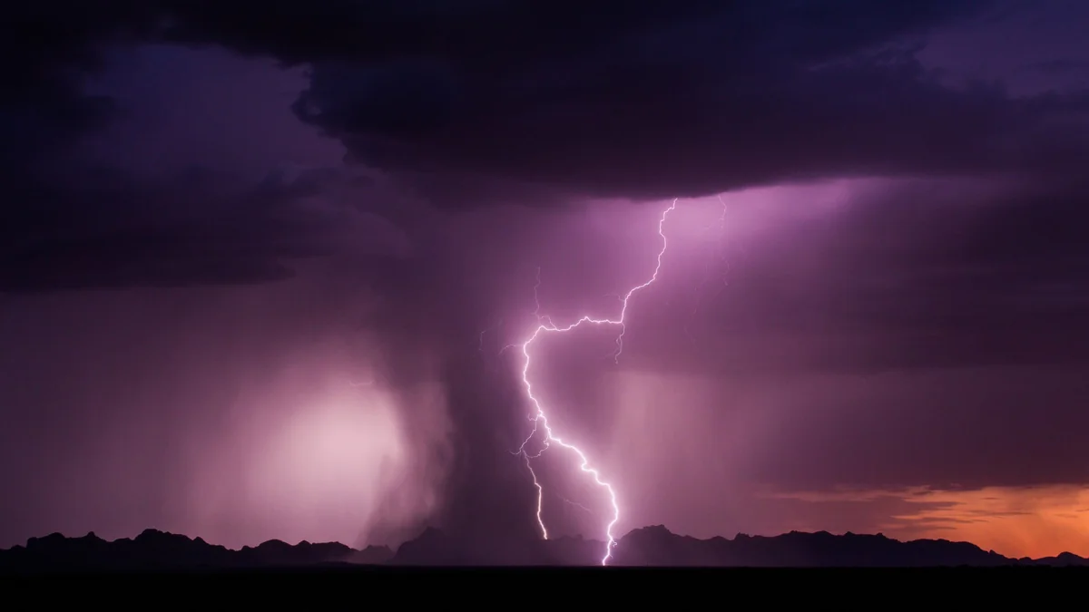 A lightning strike over the horizon in an American desert