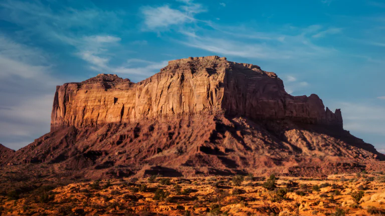 The red cliffs of the Valley of Monuments under the midday sun