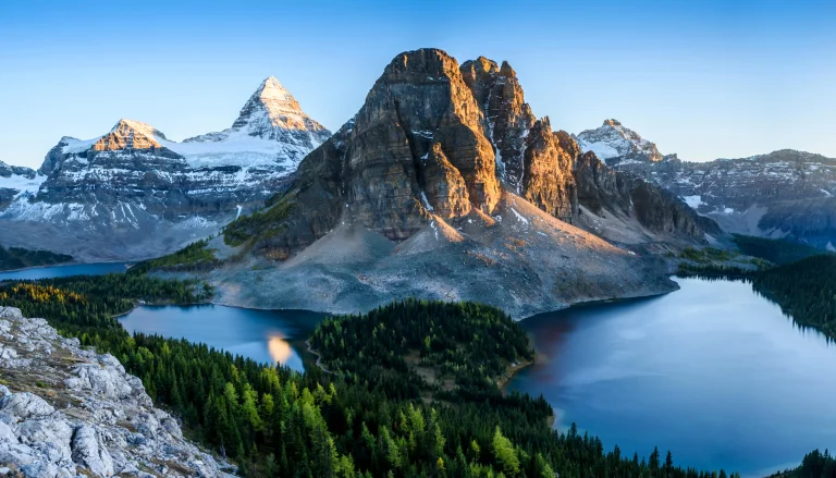 The golden light of dawn on Mount Assiniboine in Canada