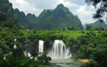 the ban zok waterfalls amid the lush green mountains of vietnam, ban zok, vietnam, asia, clouds, forest, forests, landscapes, mountains, peaks, hills, rivers, canals, streams, waterfalls, nature