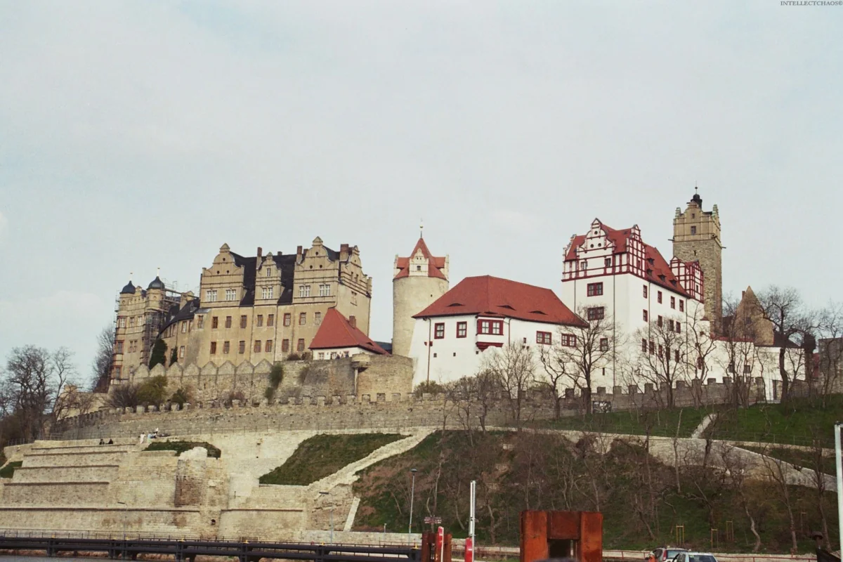 The ancient Bernburg Castle on the high bank of the Saale River in Germany