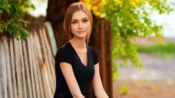 a girl by a wooden fence, brunettes, girls, young women, leaves, foliage, leafage, frondage, look, views, glance, models, summer, trees, other, people