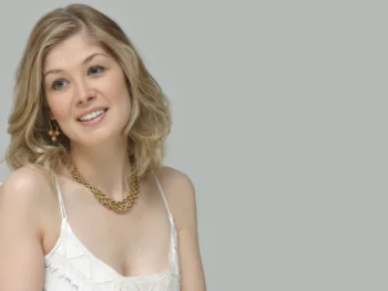 Rosamund Pike in a light-colored outfit