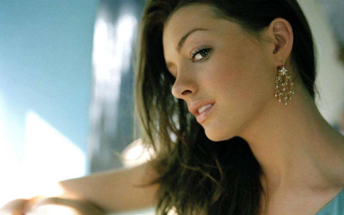 Anne Hathaway in the soft light by the window
