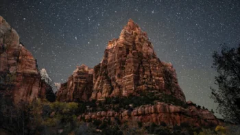 The starry sky above the cliffs of Zion National Park