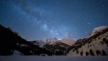 The Milky Way over the snow-capped peaks of the Alps