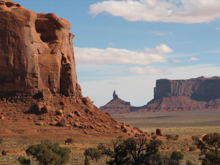 The red cliffs of the Valley of Monuments bathed in the afternoon sun