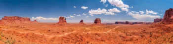 A panoramic view of the Valley of the Monuments in Arizona under a clear sky