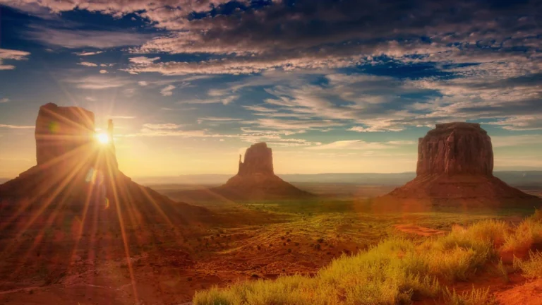 A golden sunrise over the cliffs of the Valley of Monuments in the U.S.