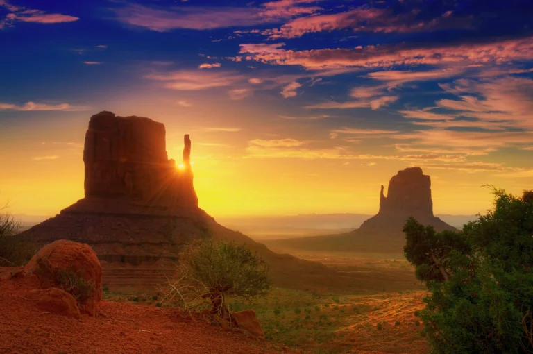 Sunset in the Valley of Monuments against a backdrop of red rocks