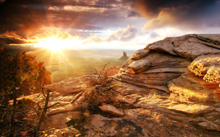 Golden rays of sunlight over the vast expanses of Utah