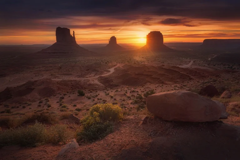 Sunset in the Valley of Monuments against a backdrop of red rocks