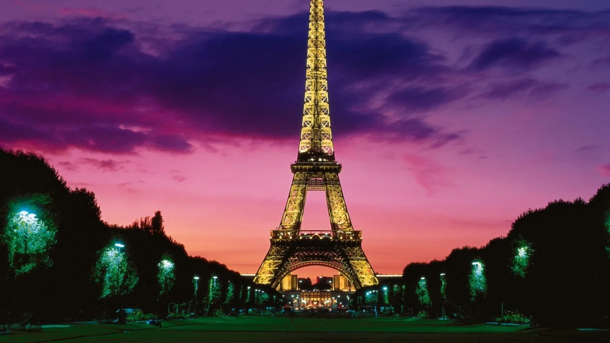 The Eiffel Tower bathed in the crimson glow of the sunset over Paris