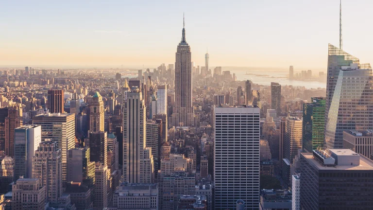 the empire state building bathed in the rays of the setting sun over new york city, cities, city, cityscape, cityscapes, megacities, new york, skyscrapers, usa, united states, architecture