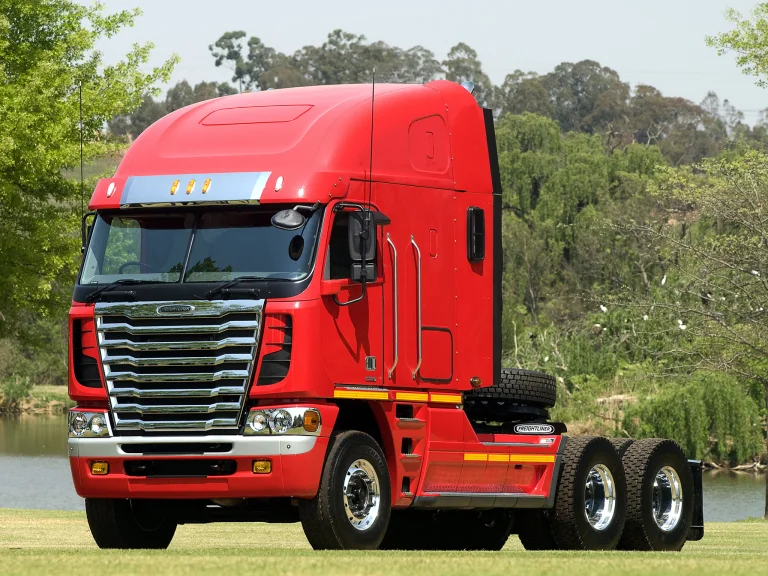 A bright red Freightliner Argosy tractor-trailer