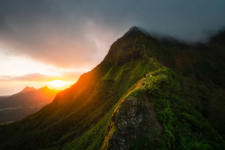 Golden rays of sunlight over the Na Pali mountain range in Hawaii