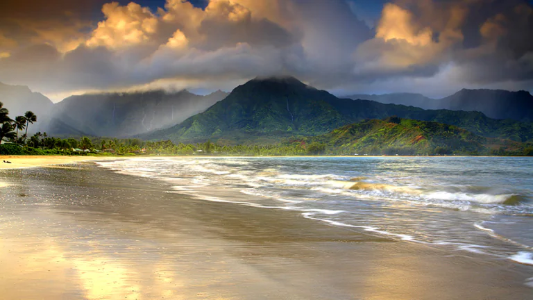 The tropical coast of Kauai under a dramatic sky