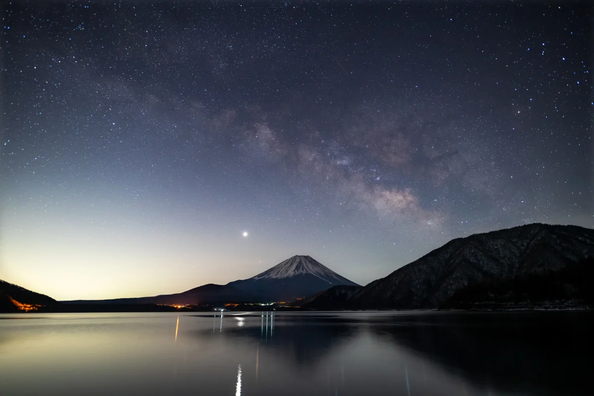 the starry sky over mount fuji and lake motosu, evening, evenings, twilight, dus, fuji, japan, lakes, bodies of water, landscapes, milky way, mountains, peaks, hills, night lights, lights, streetlights, street lamps, lighting, night, stars, sunsets, sunset, volcanoes, nature, world