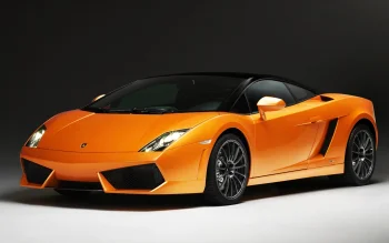 An orange Lamborghini Gallardo under studio lighting