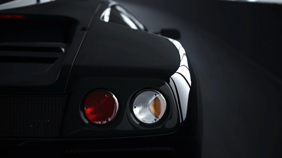 Задние фонари и карбоновые детали Lamborghini Diablo GT в полумраке