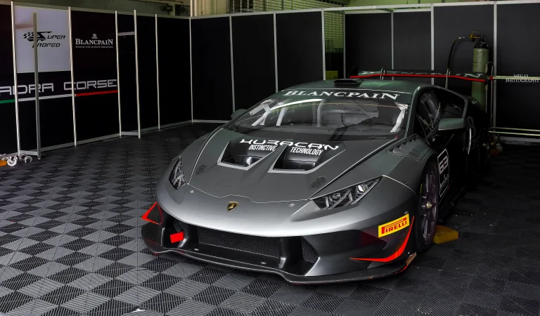 A Lamborghini Huracan Super Trofeo race car in the pits before the race