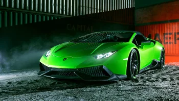 A bright green Lamborghini Huracan against a backdrop of shipping containers