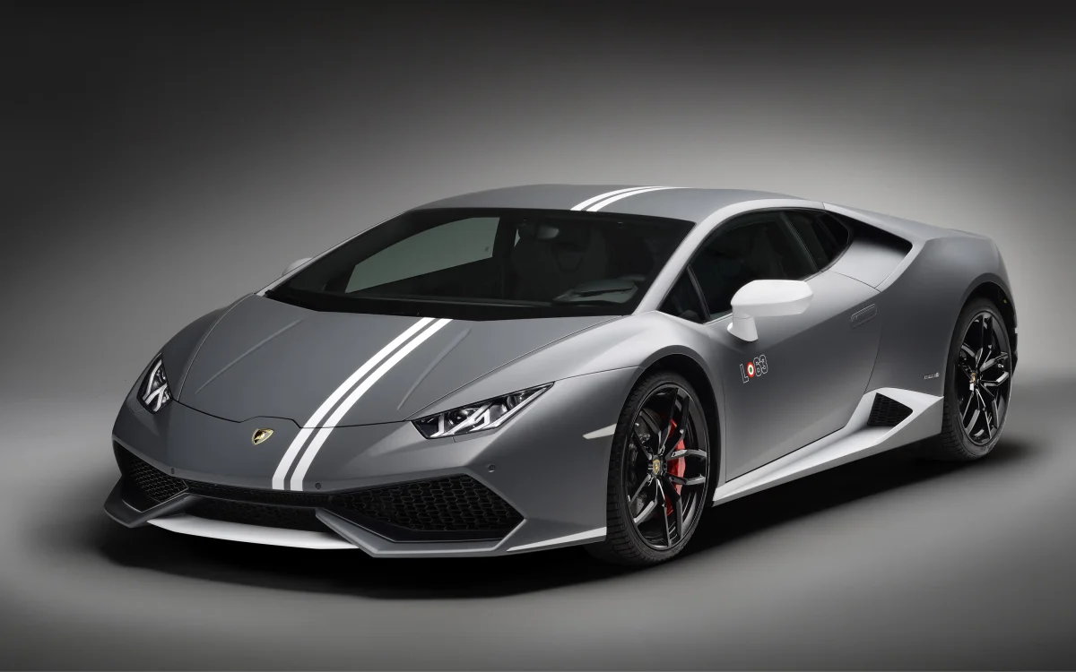 A gray Lamborghini Huracan under studio lighting
