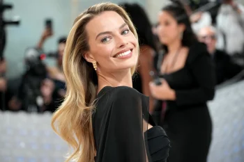 a radiant margot robbie at a social event, actresses, celebrities, personalities, hollywood, margot robbie, smiles, women, movies, cinema, people