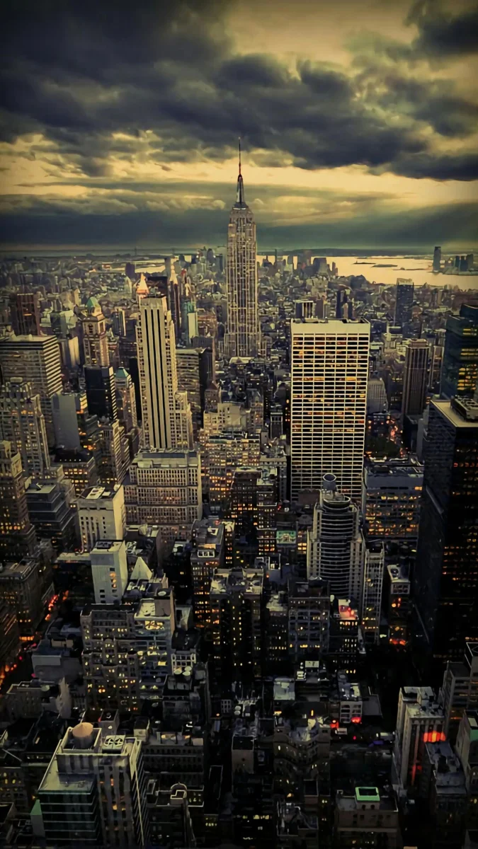 The Empire State Building at dusk against the New York City skyline